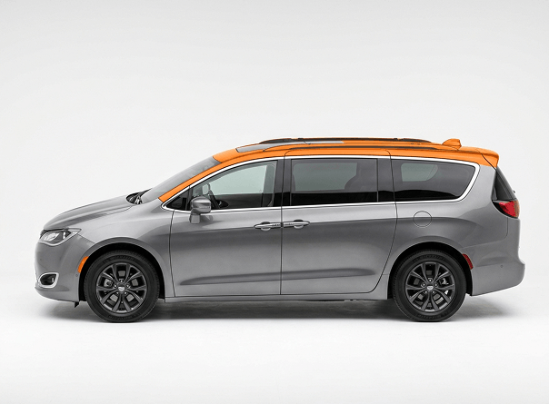 Vehicle with hail-damaged roof and mirror highlighted in orange